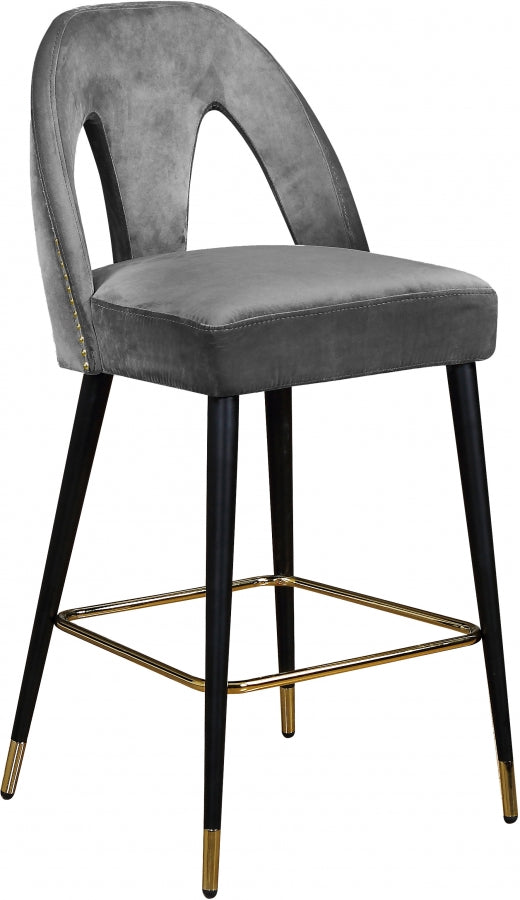 Tabouret de comptoir Aleyda en velours, disponible en 5 coloris